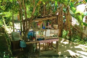 Tiny food stall selling coffee, noodlesoup and sweets on a side road in Sorong