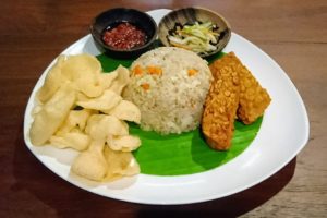 Plate of fried rice with tempe, kerupuk and sambal